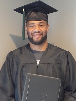 Titus in cap and gown